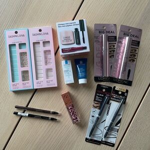 Large Unopened makeup lot - Clinique, eyeliners, blush, press on nails large lot